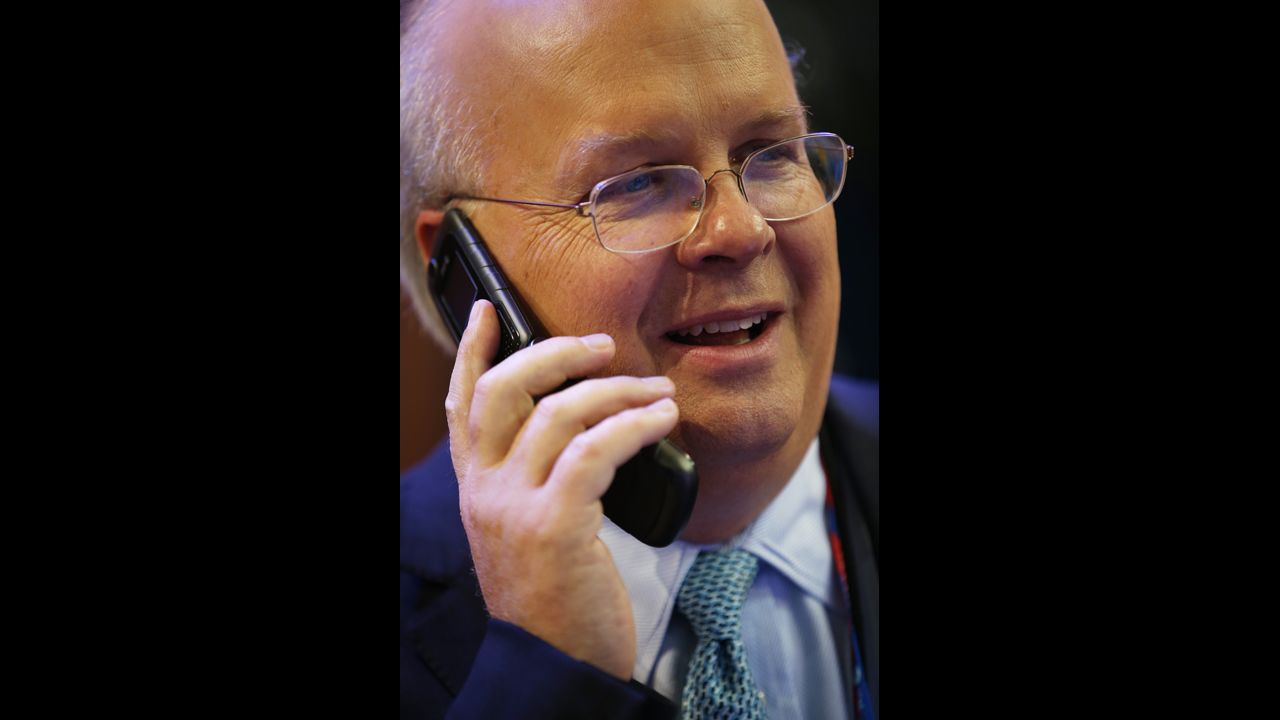 Karl Rove, former deputychief of staff and senior policy adviser to President George W. Bush, talks on a phone at the convention hall.