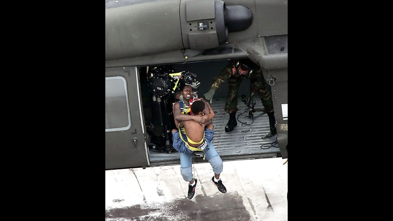 A helicopter rescues a family from a rooftop on September 1, 2005. Floodwaters from Hurricane Katrina stranded thousands of New Orleans residents.