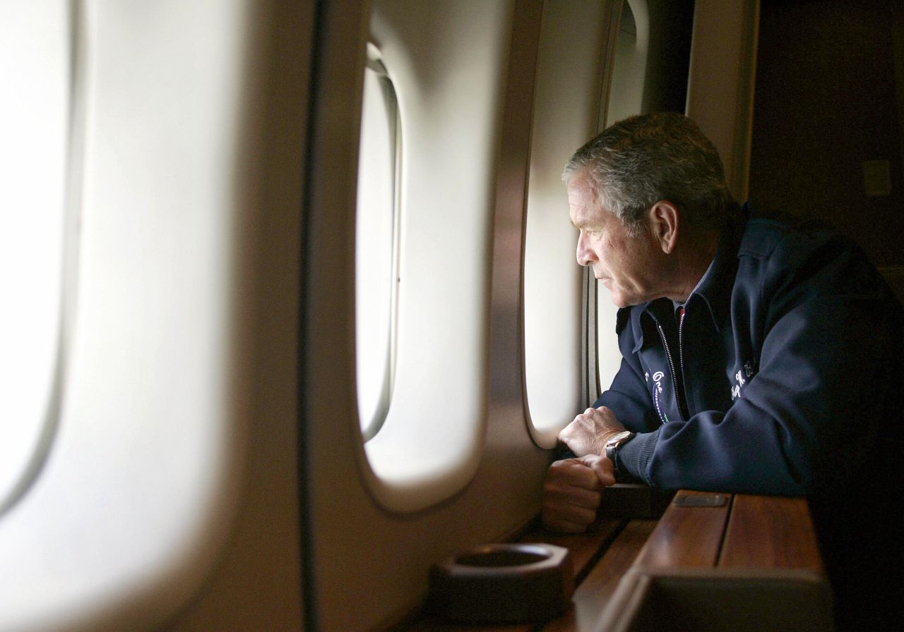President George W. Bush looks out the window of Air Force One on August 31, 2005, as he flies over New Orleans. Returning to Washington from Texas, Air Force One descended to about 5,000 feet to allow Bush to view some of the worst damage from Hurricane Katrina.