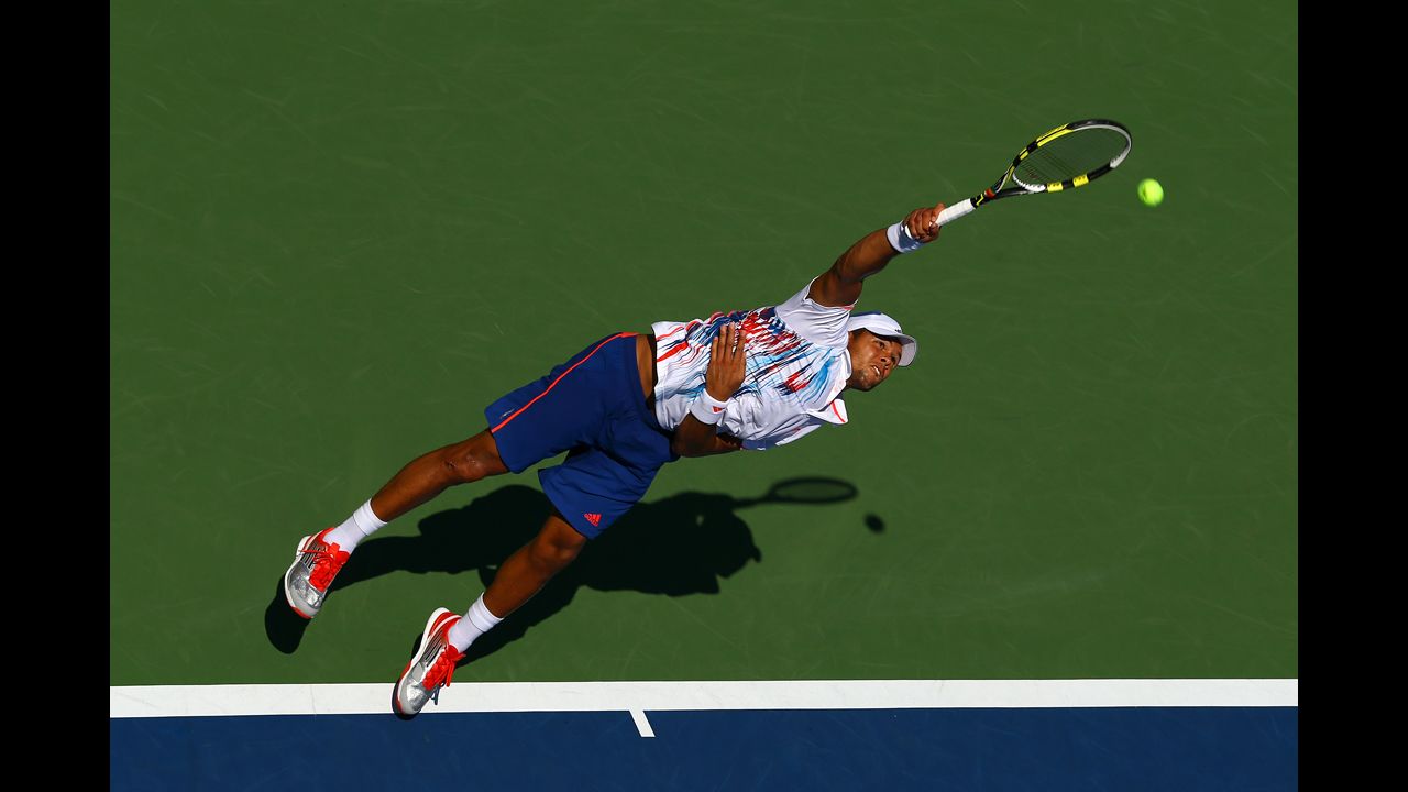 Jo-Wilfried Tsonga of France serves against Karol Beck of Slovakia during their first-round match on day two.
