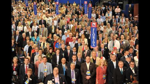 Delegates from host state Florida face photographers and cameras as they pose for the official convention photograph.