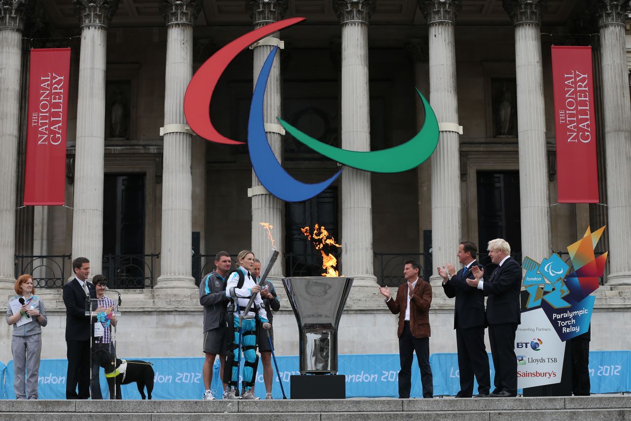 Disabled marathon runner Claire Lomas, center, lights the Olympic cauldron for the Paralympic Games in Trafalgar Square on August 24, 2012. The London 2012 Paralympic Games open on August 29 for 12 days.