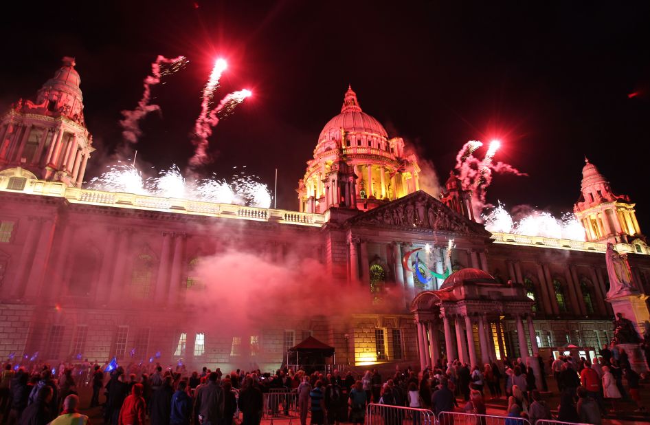 People watch a fireworks display on August 25 after a Paralympic cauldron was lit outside Northern Ireland's parliament in Belfast, the second of four in Britain's capital cities ahead of the 2012 Games.