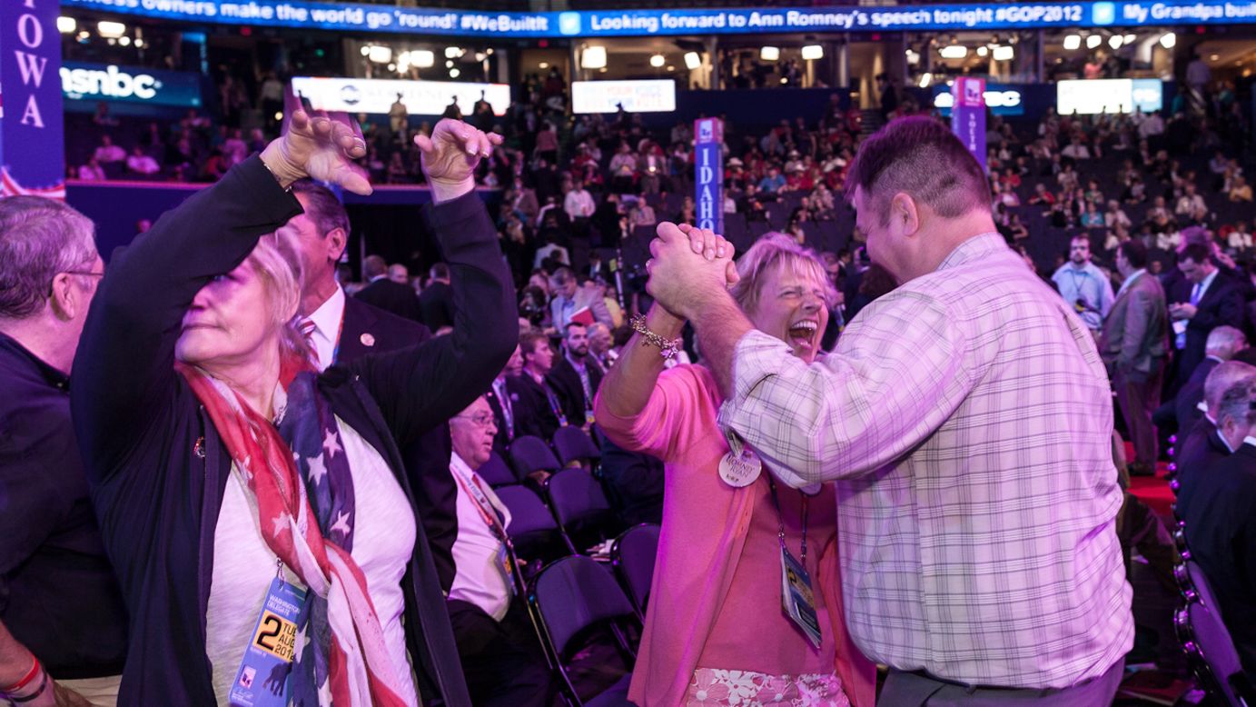 Washington state delegates Trin Wilbur and Jeff McMorris dance on the convention floor.