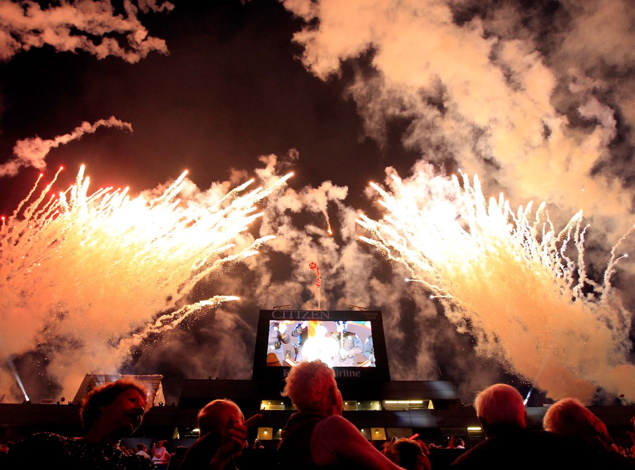 Fans watch fireworks as actress/singer Jordin Sparks performs the national anthem during the opening ceremonies.