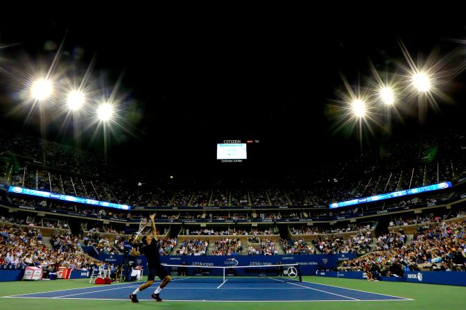 Switzerland's Roger Federer serves to American Donald Young during their men's singles first-round match.