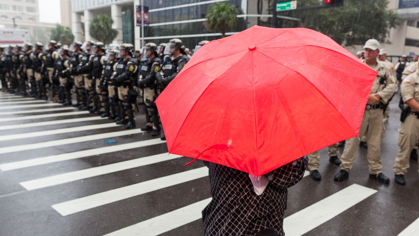Tampa security forces line up to block a small group of demonstrators on Monday, August 27. 