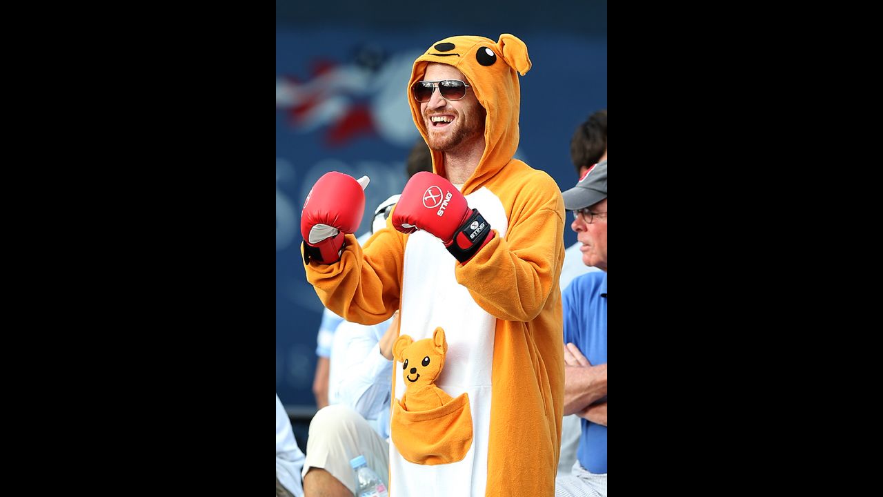 A spectator in a kangeroo costume cheers from the stands during the match between Tatsuma Ito of Japan and Matthew Ebden of Australia.