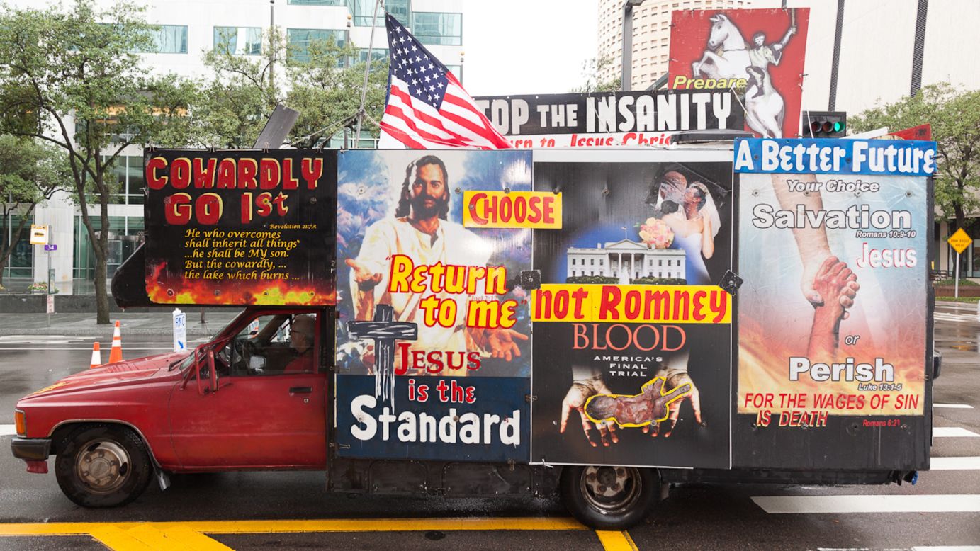 One of many message-covered vehicles drives through the streets of Tampa.