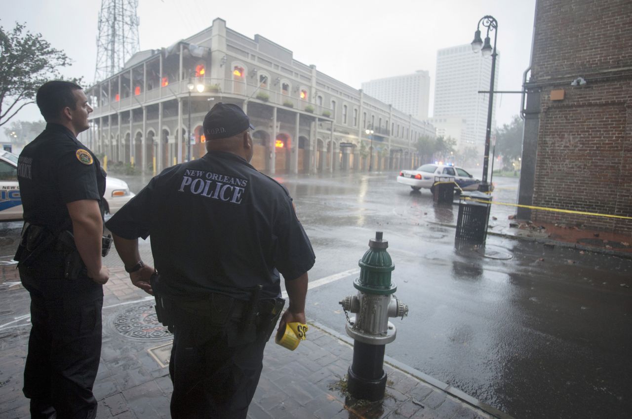 Police officers stand watch in the French Quarter.