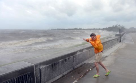 Evan Stoudt faces strong winds from the banks of Lake Pontchartrain.