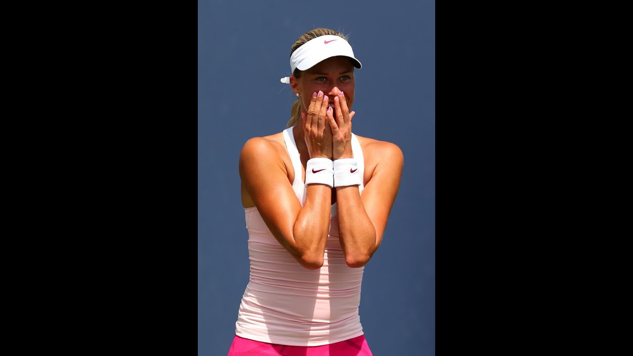 Andrea Hlavackova of the Czech Republic celebrates after defeating Klara Zakopalova, also of the Czech Republic, in the first round.