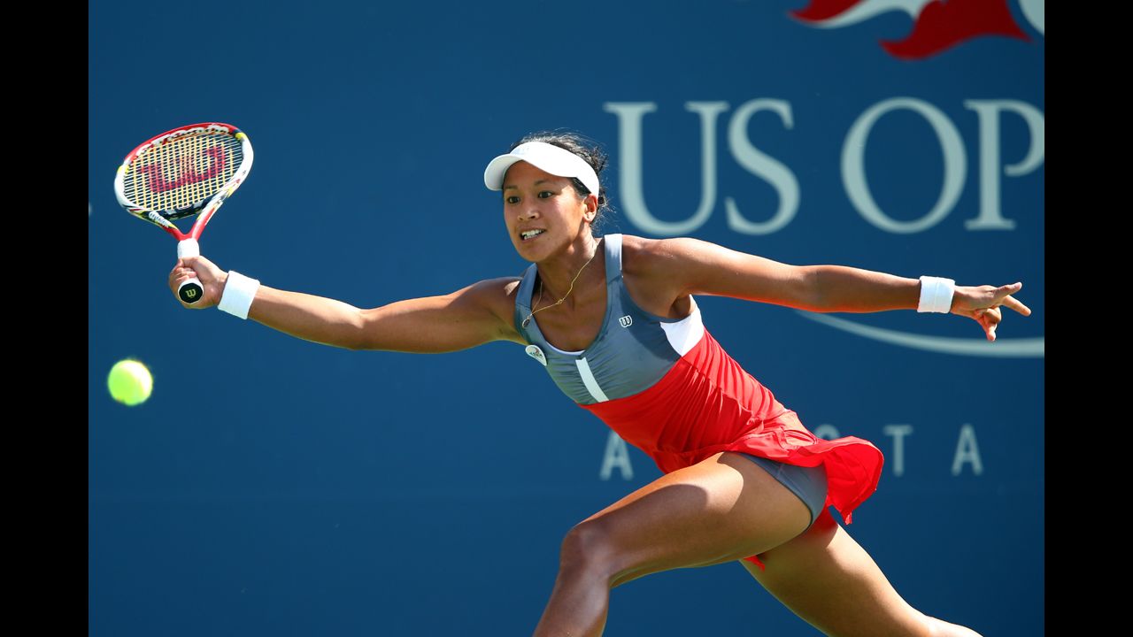 Anne Keothavong of Great Britain returns a shot during her first-round match against Angelique Kerber of Germany.