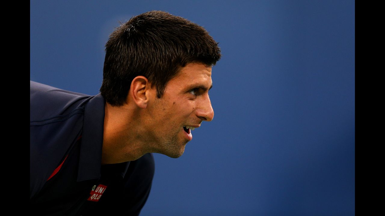 Serbian Novak Djokovic looks on against Italian Paolo Lorenzi during their men's single first-round match.