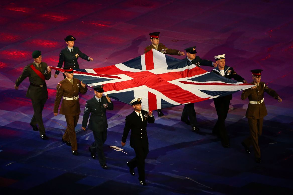 Service members from the Army, Royal Navy and Royal Air Force display the Great Britain flag.