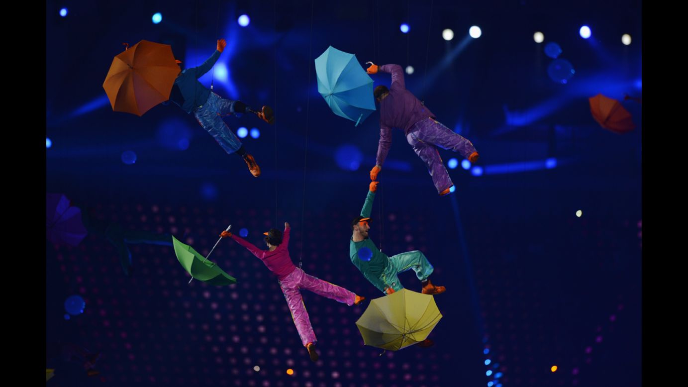 Artists perform with colorful umbrellas during the opening ceremony.
