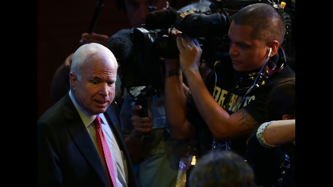 Arizona Sen. John McCain walks the floor.