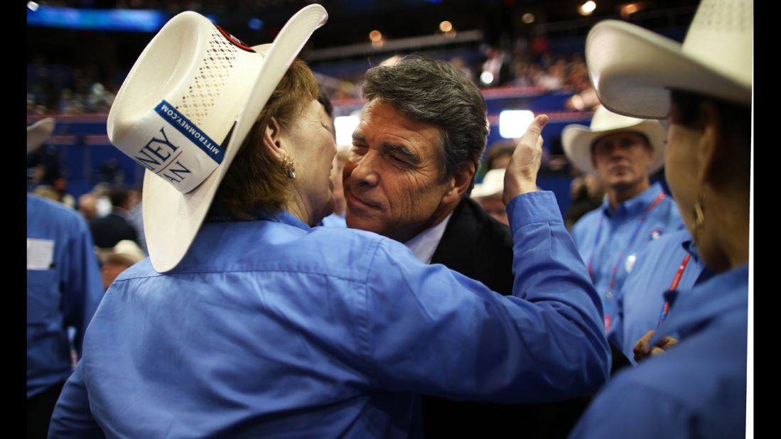 Rosemary Edwards of Austin, Texas, kisses the face of Texas Gov. Rick Perry.