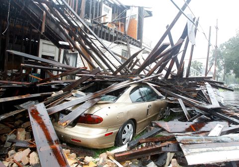 A house in New Orleans collapsed during the height of Hurricane Isaac, destroying three vehicles parked alongside it Wednesday.