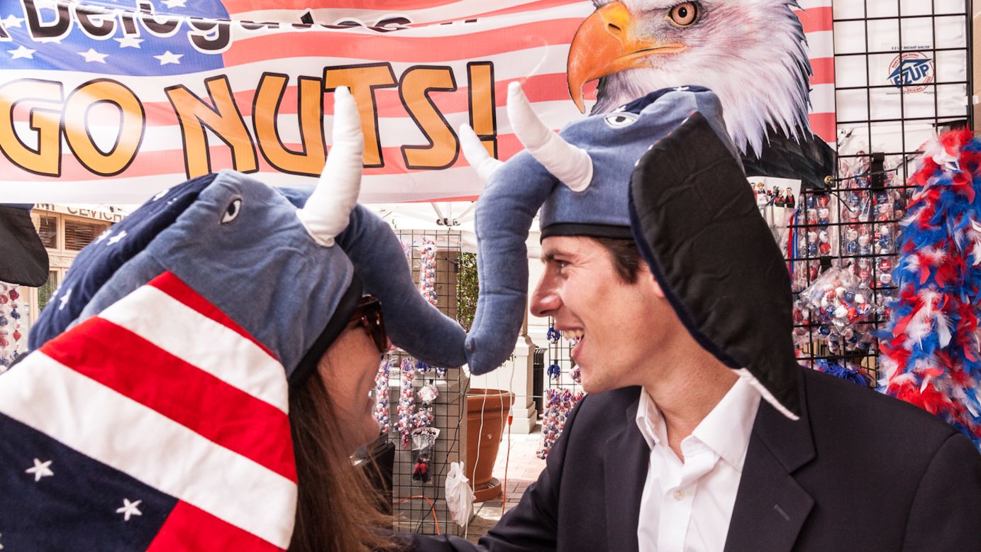 People try on hats at Riverside Park in Tampa on Wednesday, August 29. 