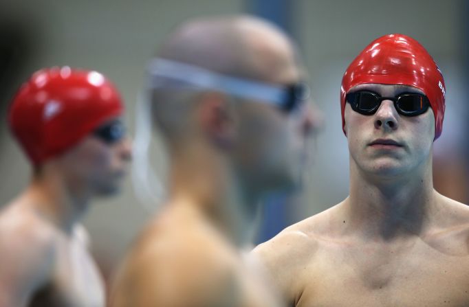 Jack Bridge, right, of Great Britain prepares to compete in the men's 200-meter individual medley - SM10 heat 2.