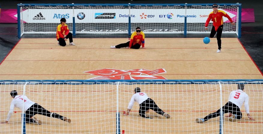 China, top, and Iran compete in the men's group B goalball match Thursday.