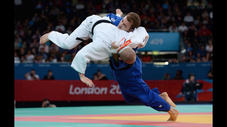 Ben Quilter, in white, of Great Britain competes against Mouloud Noura of Algeria during the men's -60 kilogram judo quarterfinal match.