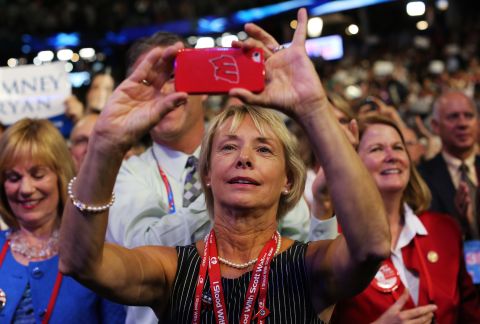 A woman snaps an image with her iPhone during Wednesday night's events.