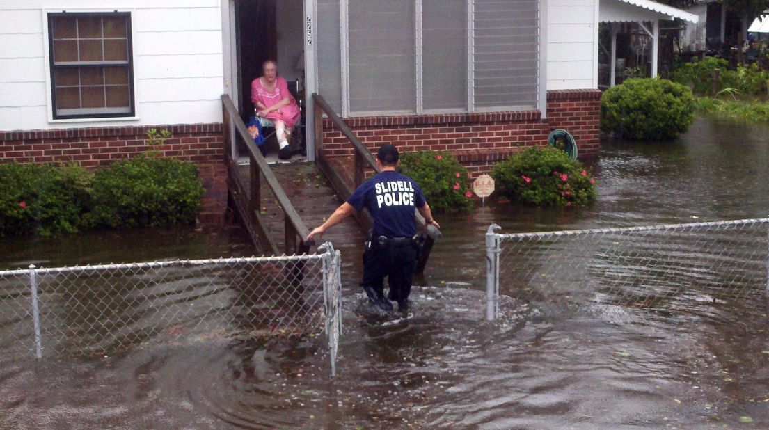 An elderly resident is rescued from her home in Slidell.