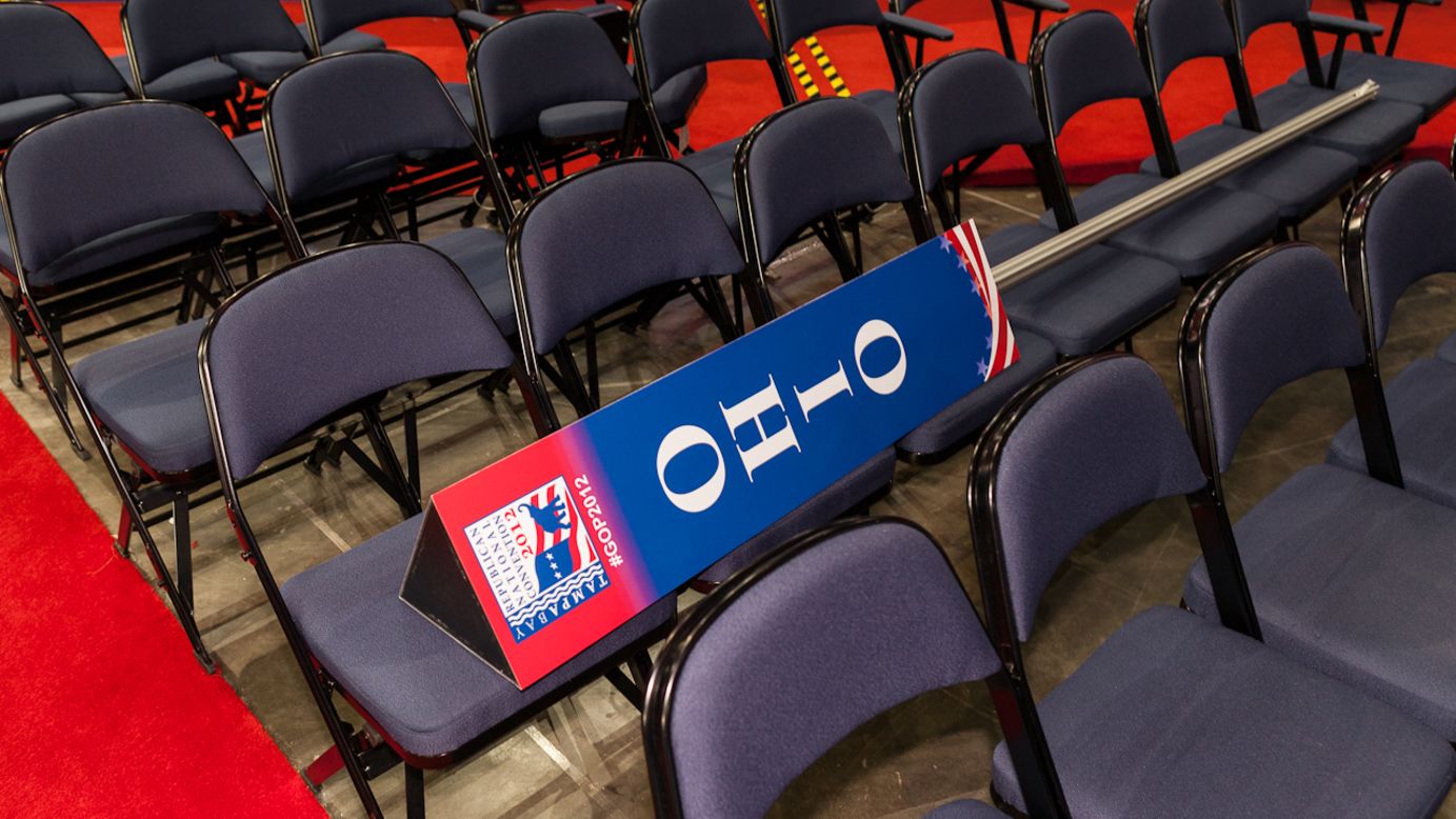 A sign marking the Ohio delegation sits on empty seats on the floor of the convention hall.