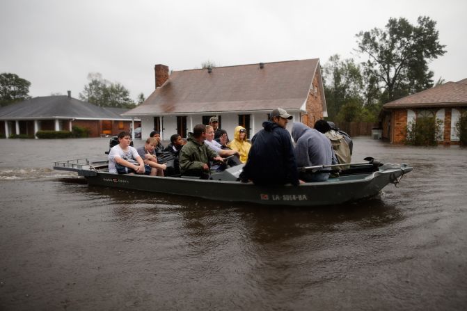 Residents are rescued Wednesday in Laplace, about 25 miles northwest of New Orleans, where the storm surge was unusually bad.