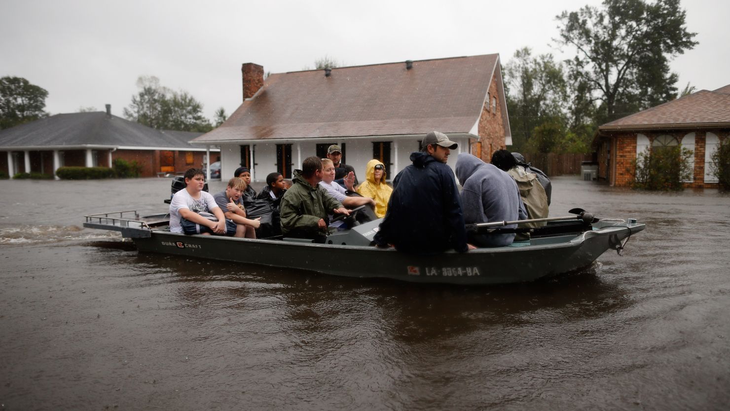 Rescue workers transport residents trapped by rising water from Tropical Storm Isaac in LaPlace, Louisiana, on Wednesday. The storm was later downgraded to a Tropical Depression.