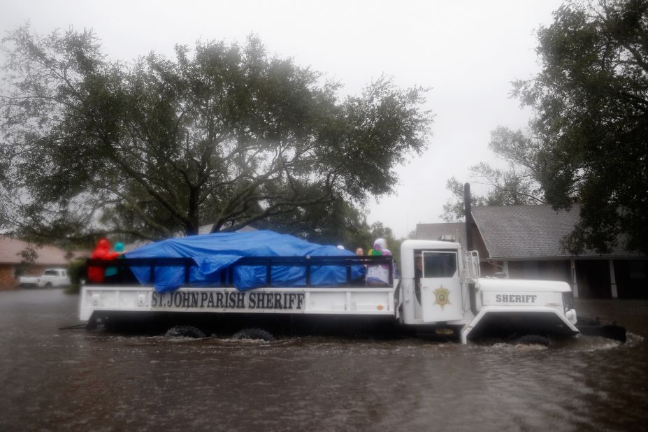 St. John Parish Sherriff officials rescue local residents from the flood waters in Laplace.