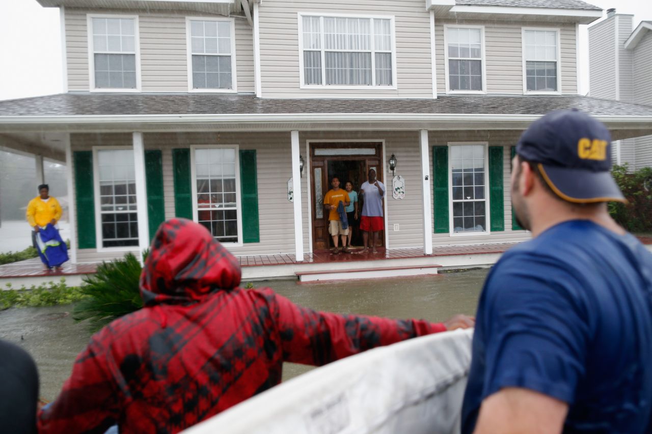Henry Cox talks with stranded residents in Laplace.
