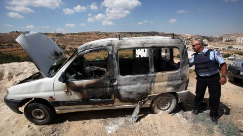 The August 16 firebombing of a taxi on the West Bank was followed 12 days later by  three more torched cars, including this one.
