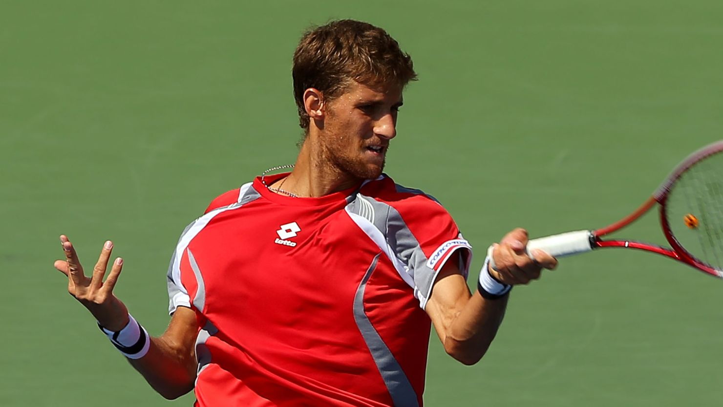 Martin Klizan of Slovakia powers a return during his four-set win over Jo-Wilfried Tsonga at the U.S. Open.