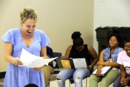 Program Director Susie Spear Purcell walks actresses through a script during Playmaking for Girls rehearsal.