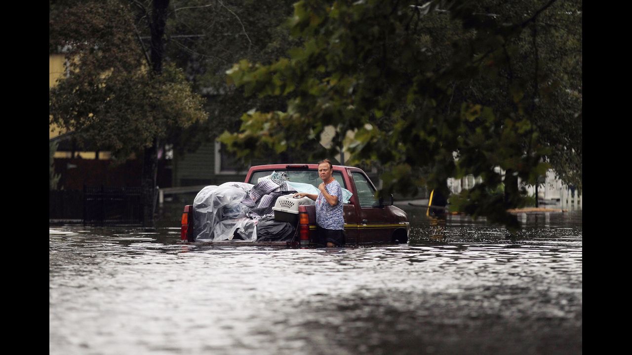  A woman is stranded with her truck in floodwaters from Isaac on the north shore of Lake Pontchartrain on Thursday in Slidell, Louisiana.