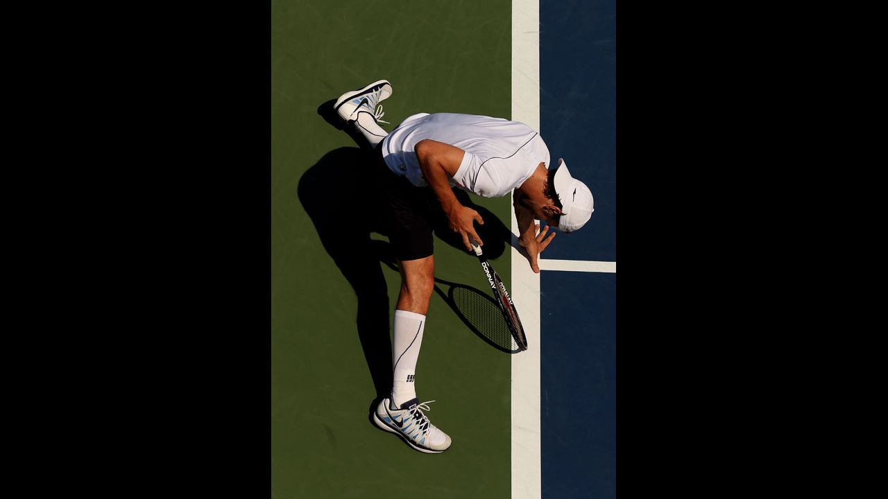 Philipp Petzschner of Germany slides during his men's singles second-round match against Nicolas Almagro of Spain.