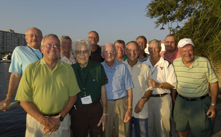 Yelton (front left) and the group of players who have competed in all previous editions of the tournament.