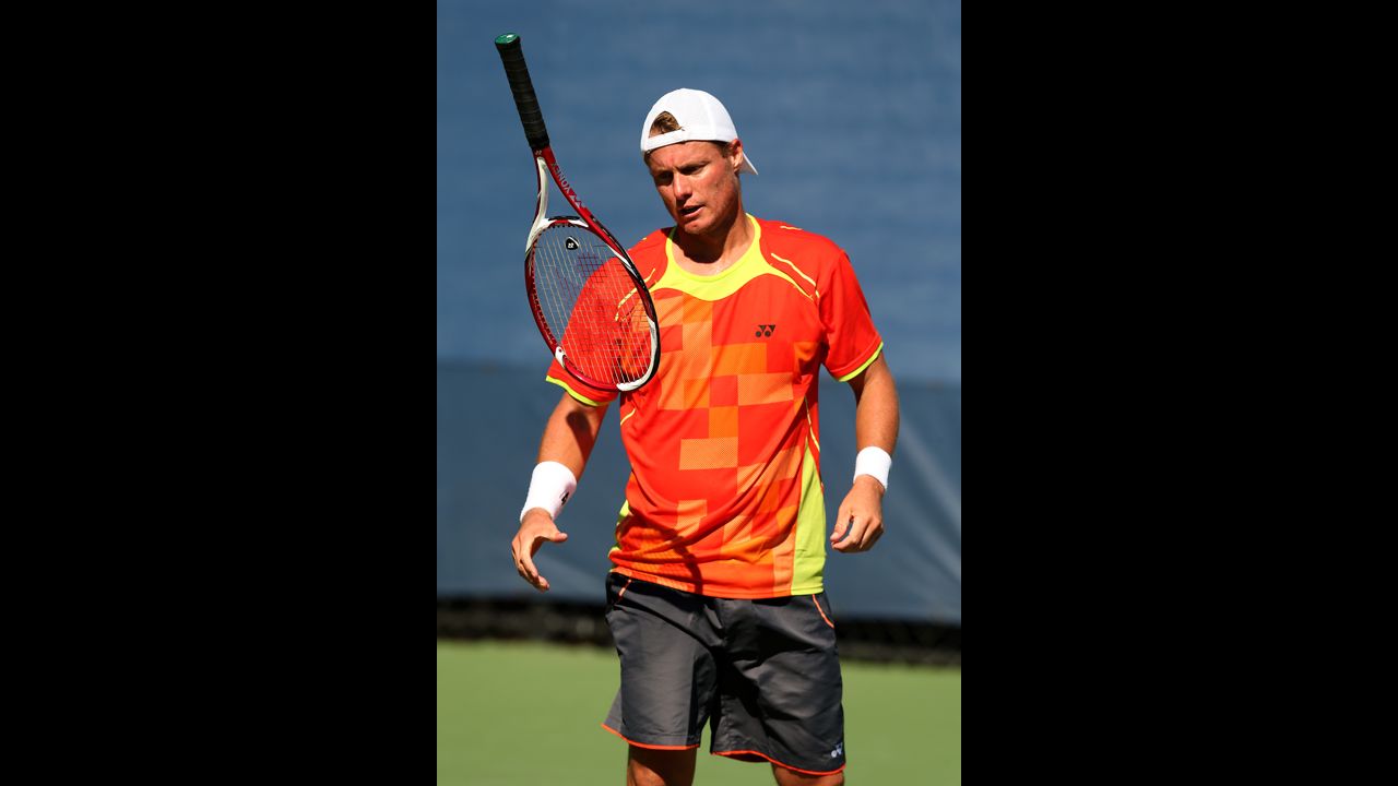 Australian Lleyton Hewitt tosses his racquet during his men's singles first-round match against German Tobias Kamke.