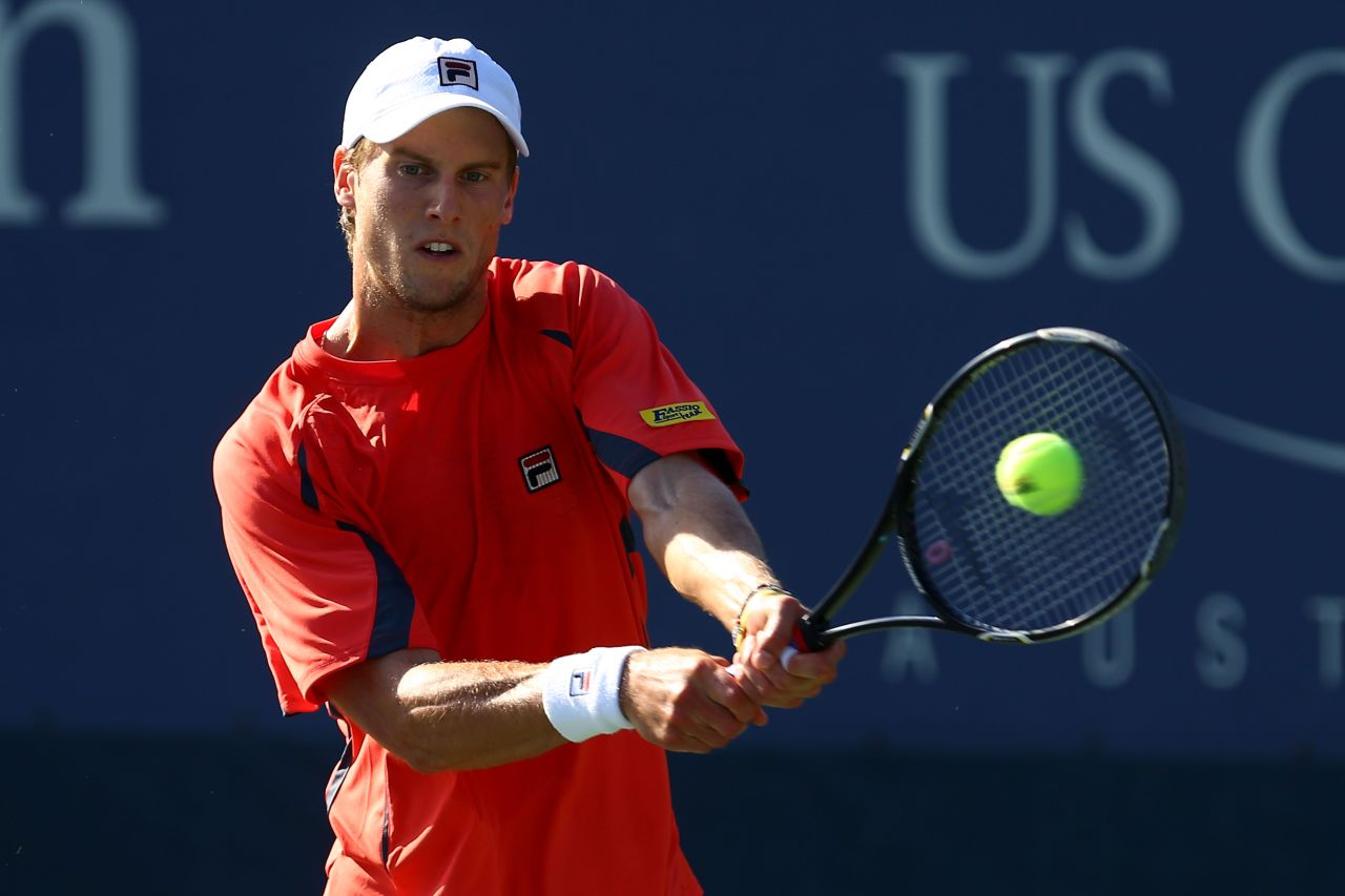 Italian Andreas Seppi hits a backhand during his men's singles first-round match against Spaniard Tommy Robredo.