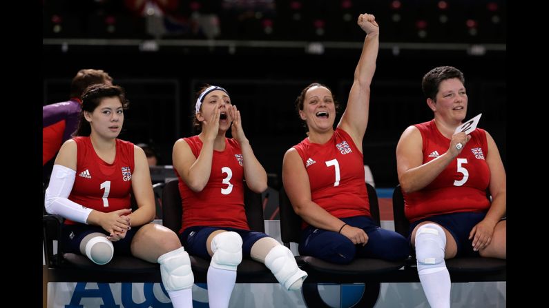 Julie Rogers, from left, Jessica Frezza, Martine Wright and Andrea Green of Great Britain react to a point during the opening game of the womens sitting volleyball tournament against Ukraine.