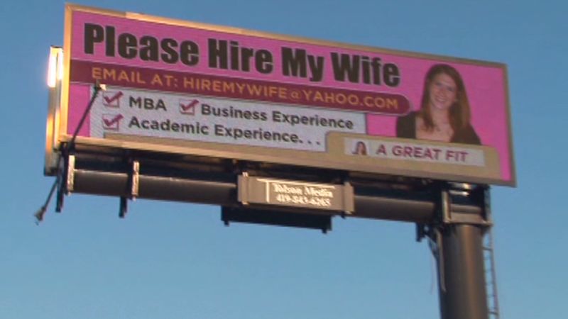 Man posts please hire my wife billboard
