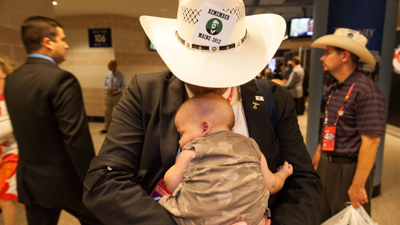 Texas delegate Read King kisses his son Benjamin on Thursday.