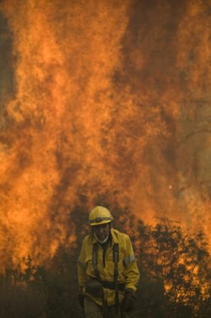  A firefighter walks on the site of a wildfire in Ojen on August 31, 2012. 