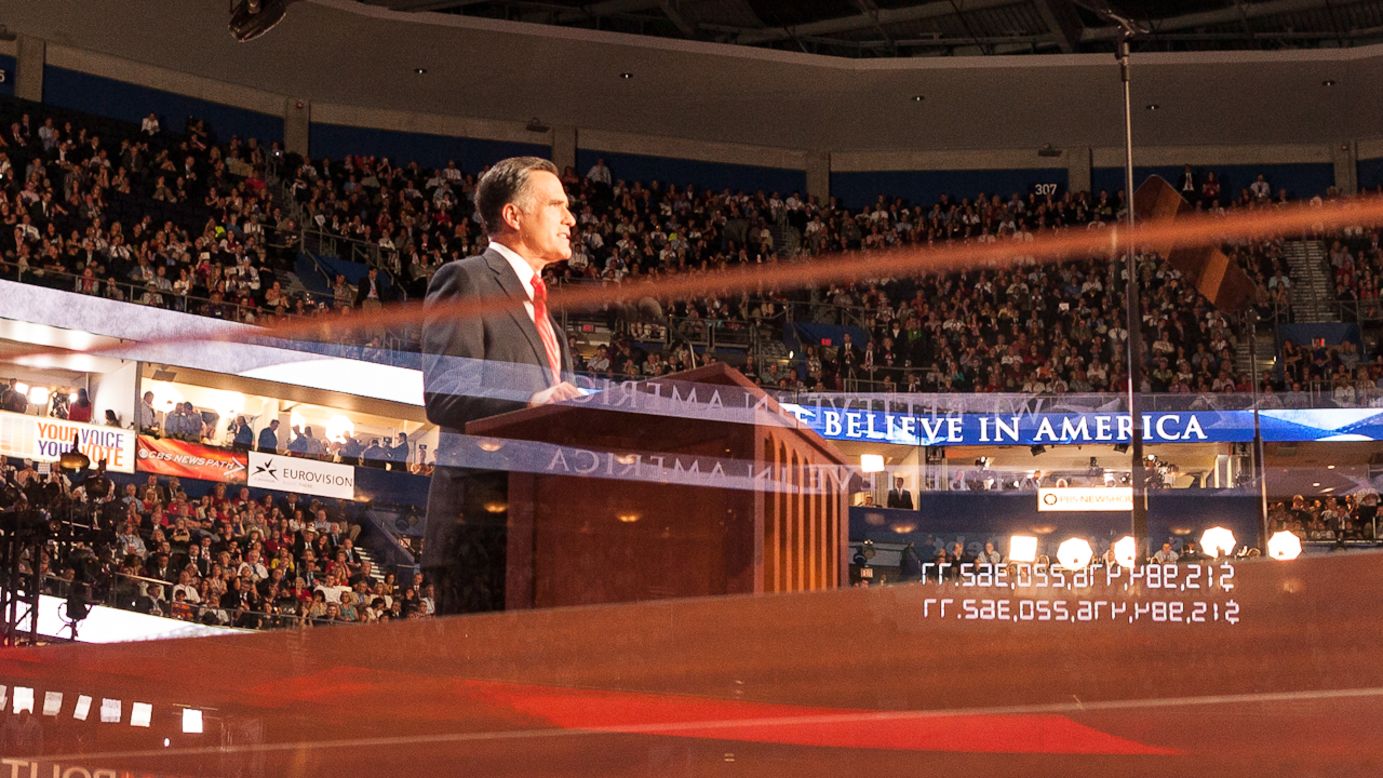 A reflection of the National Debt Clock is seen as Mitt Romney speaks on the last night of the convention.