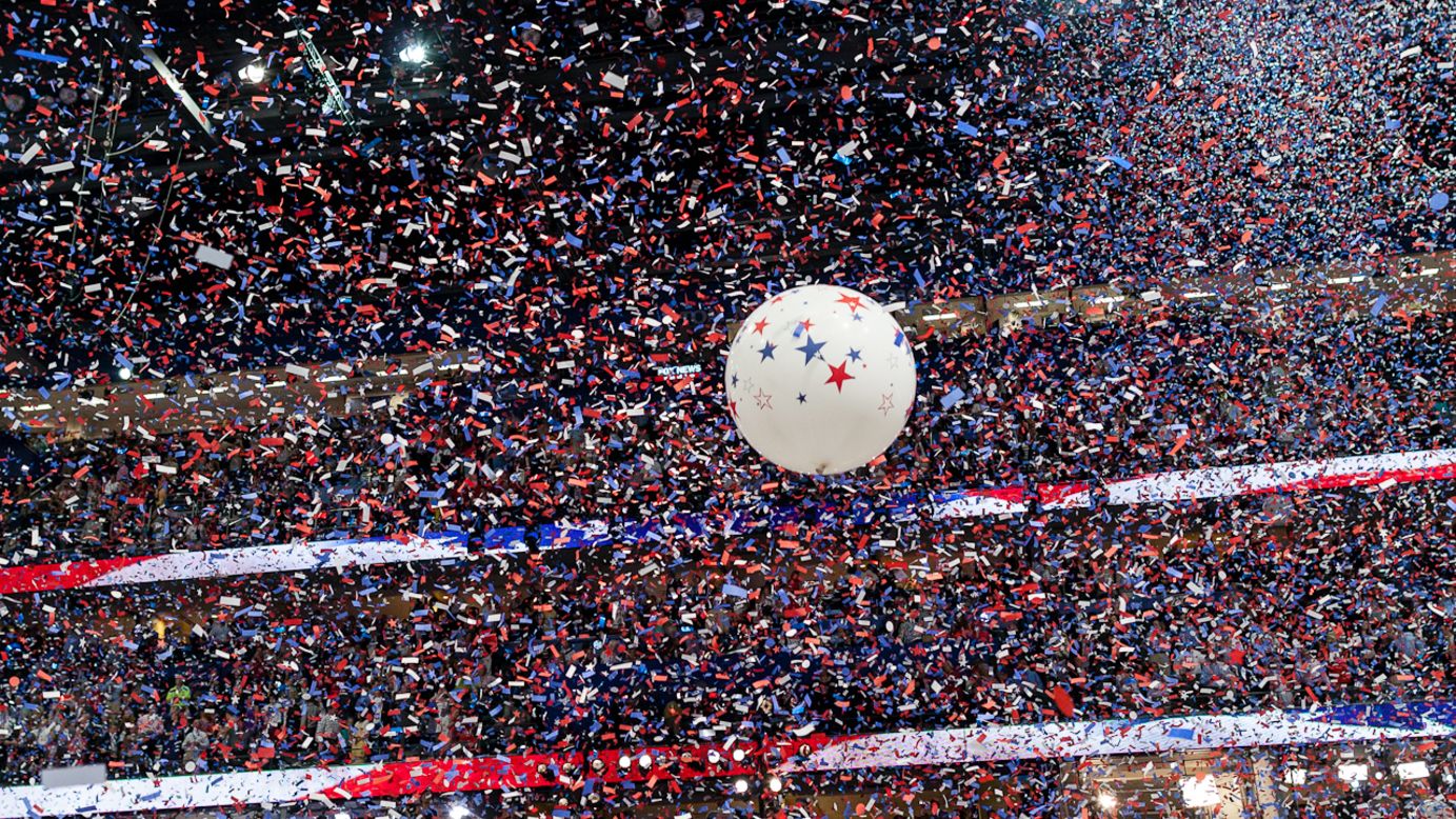 Balloons and confetti drop after Romney's speech. 