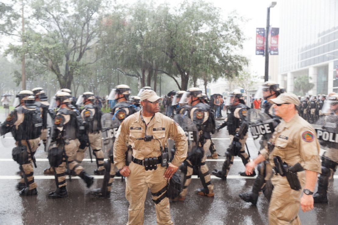 Police march by during the Republican convention on Thursday, August 30. - (Zoran Milich for CNN)