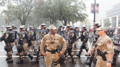 Police march by during the Republican convention on Thursday, August 30. - (Zoran Milich for CNN)
